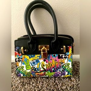 A very cute retro stylish hand bag with a gold strap attached!!